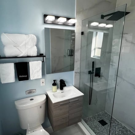 Modern bathroom with walk-in shower and marble tile