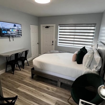 Suite bedroom with Smart TV and modern decor