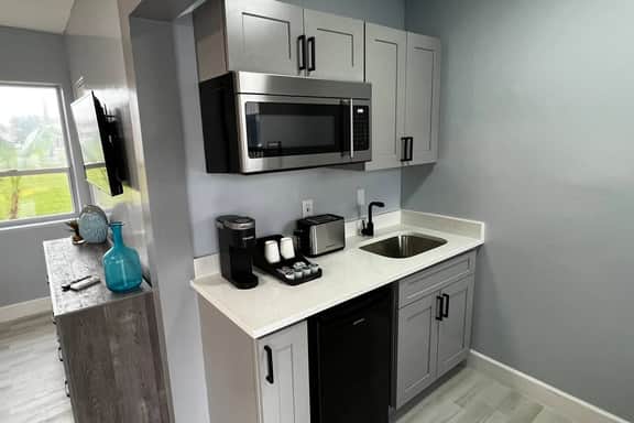 The Kitchenette is equipped with mini fridge, microwave, toaster, Keurig coffee machine with coffee pods. Also available for you are cups, plates, bowls, utensils, ice bucket, bottle opener and paper towel roll.